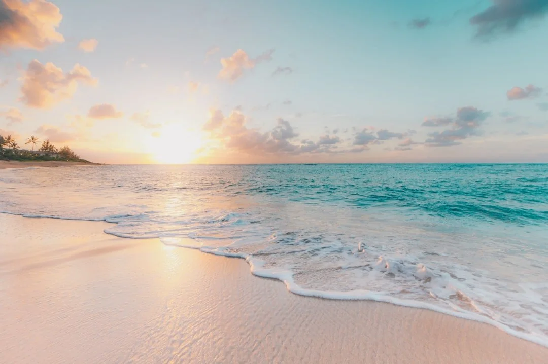 Sunrise light across a quiet West Maui shoreline