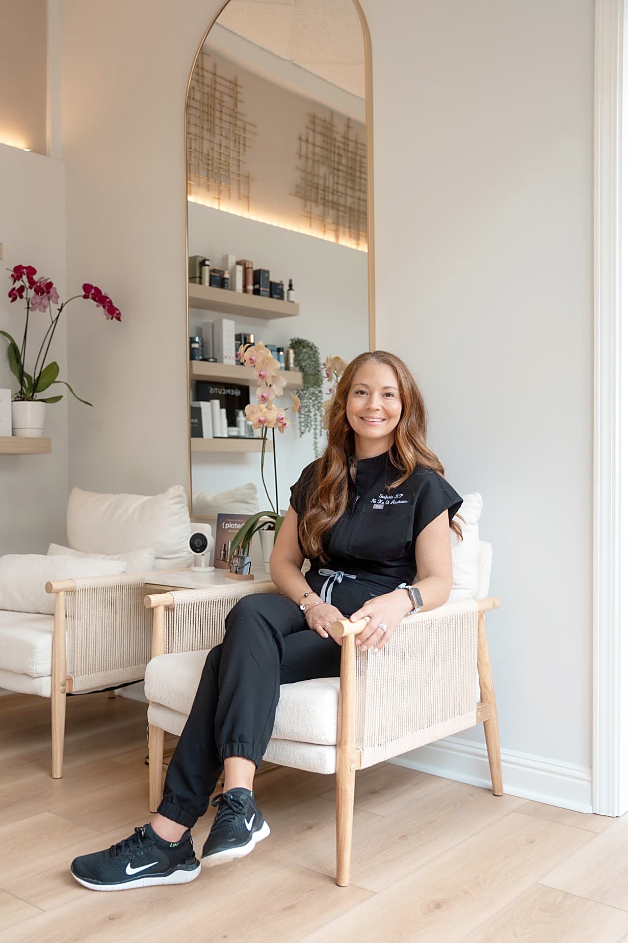 Stefanie Roberts, ARNP, founder of Nō Ka ʻOi Aesthetics, seated in the treatment lounge